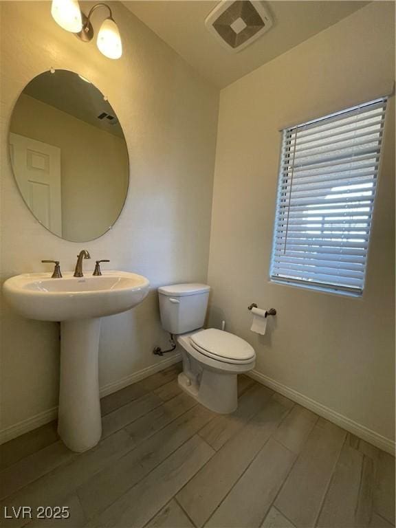 bathroom featuring sink and toilet