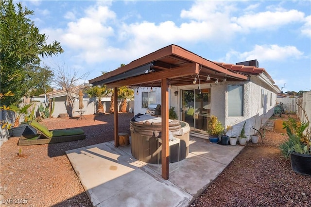 view of patio with a hot tub