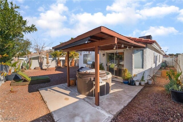 view of patio with a hot tub