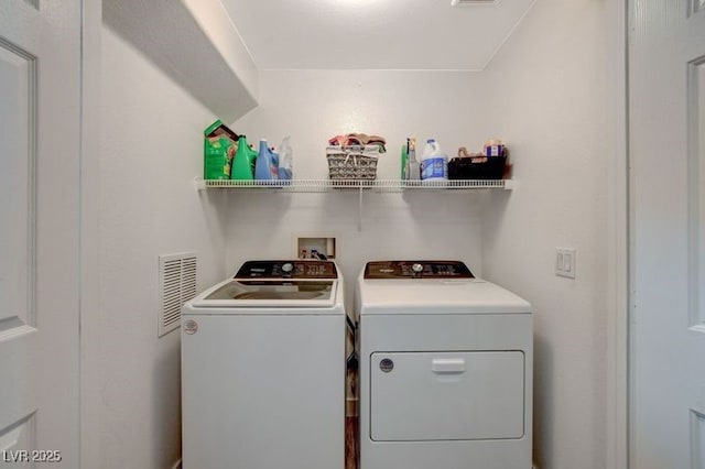 laundry area featuring washing machine and dryer