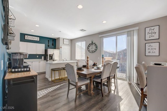 dining area featuring dark hardwood / wood-style floors