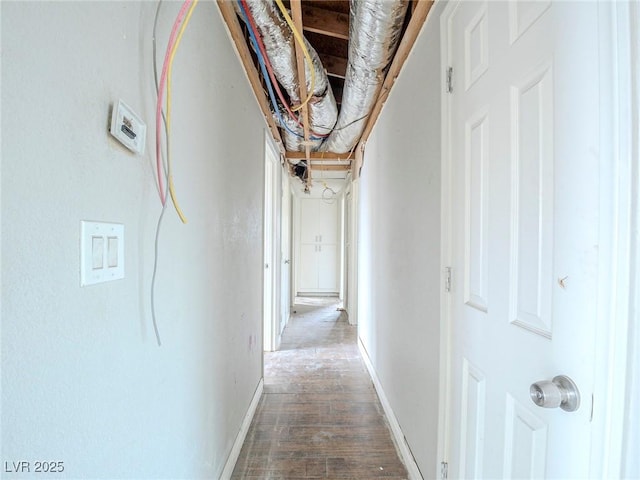 hall with hardwood / wood-style flooring