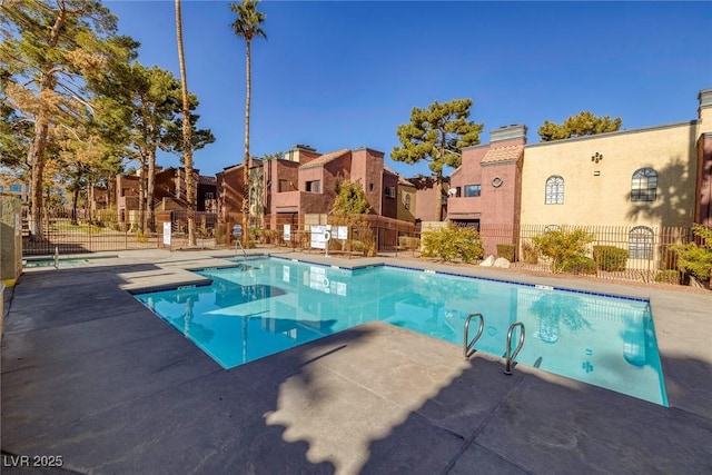 view of swimming pool with a patio