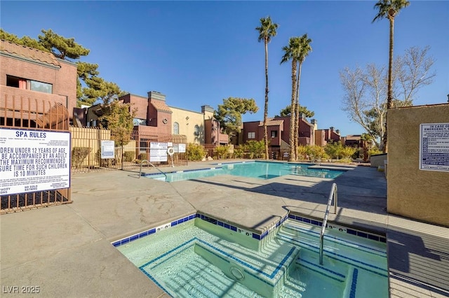 view of pool featuring a patio area and a community hot tub