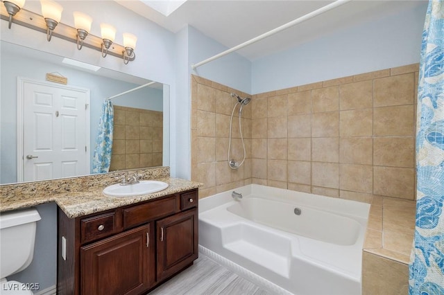 full bathroom featuring toilet, vanity, and shower / bathtub combination with curtain