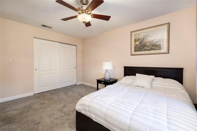 bedroom featuring ceiling fan, a closet, and carpet flooring