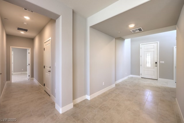 hallway featuring light tile patterned floors