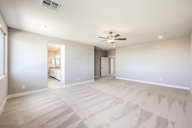 empty room with light carpet and ceiling fan