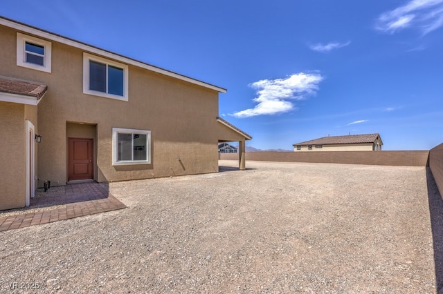 rear view of property featuring a patio area