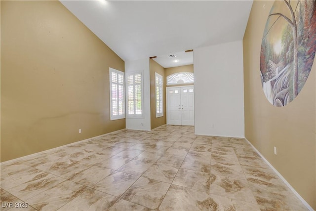 foyer with vaulted ceiling