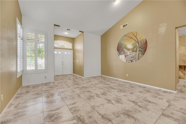 foyer with lofted ceiling