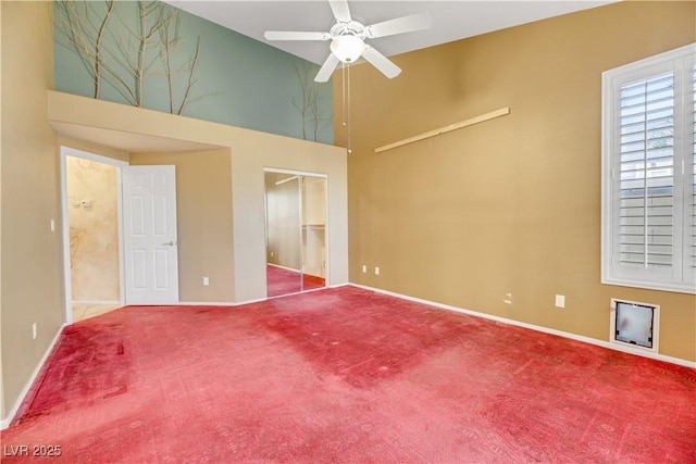 unfurnished bedroom with ceiling fan and carpet flooring