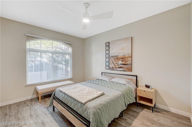 bedroom with hardwood / wood-style floors and ceiling fan