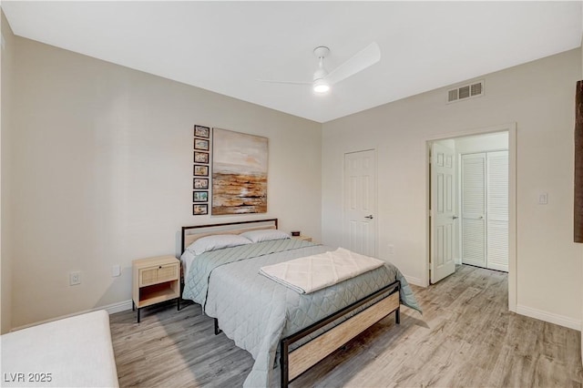 bedroom with hardwood / wood-style floors and ceiling fan