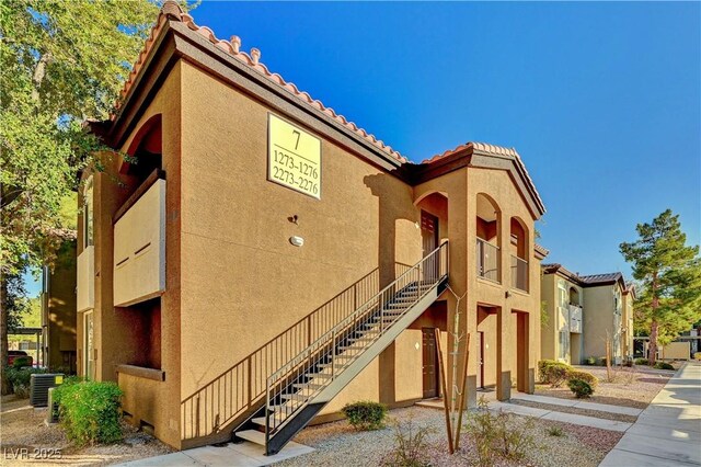 view of property with central AC unit