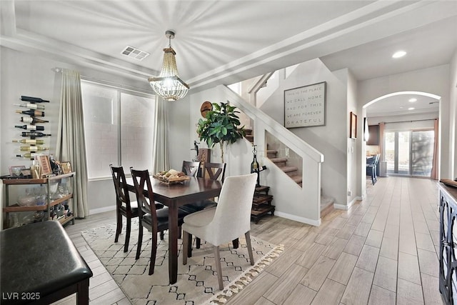 dining area featuring an inviting chandelier