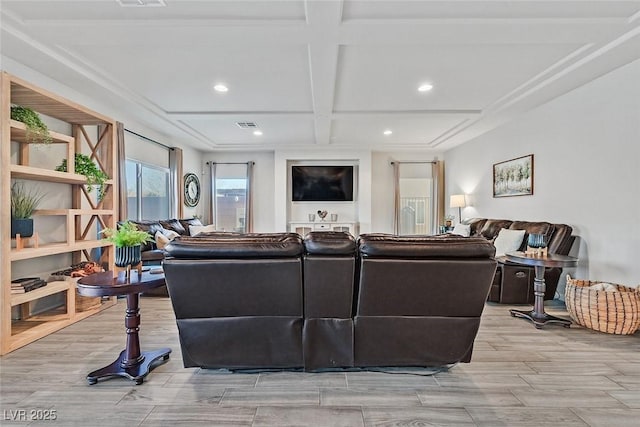 living room featuring coffered ceiling and beamed ceiling