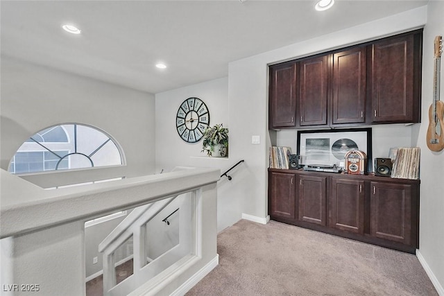 kitchen with light colored carpet