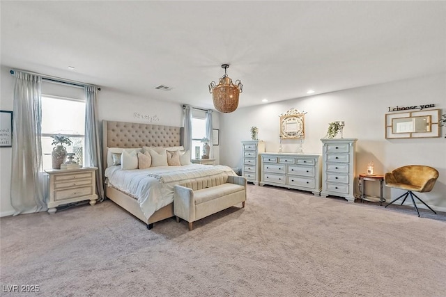 carpeted bedroom featuring multiple windows