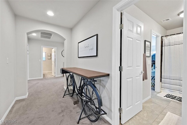 hallway with light carpet