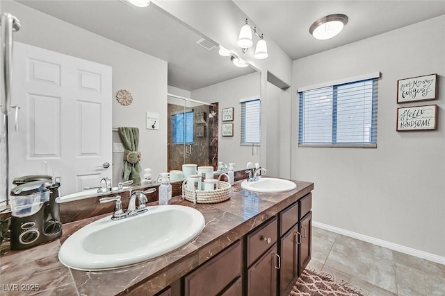 bathroom with tile patterned floors, a shower with door, and vanity