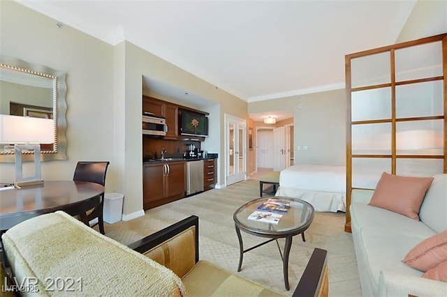 living room featuring sink and ornamental molding