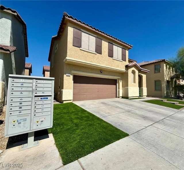 mediterranean / spanish home featuring a front lawn and a garage