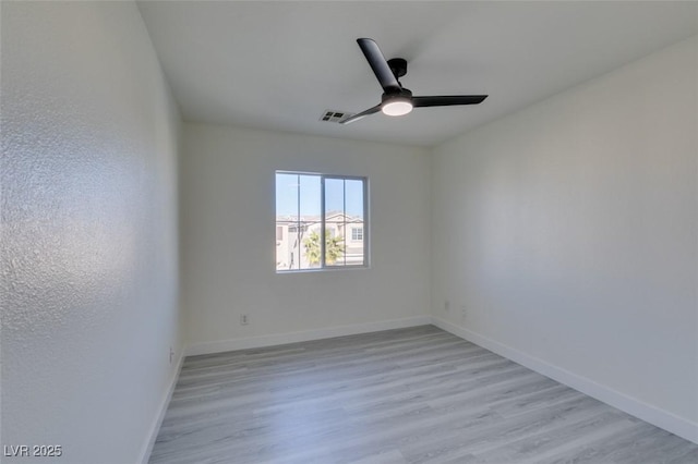 unfurnished room with ceiling fan and light hardwood / wood-style flooring