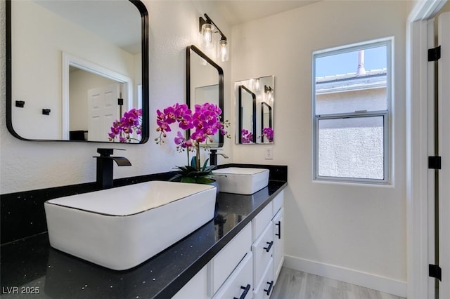 bathroom with vanity and hardwood / wood-style floors