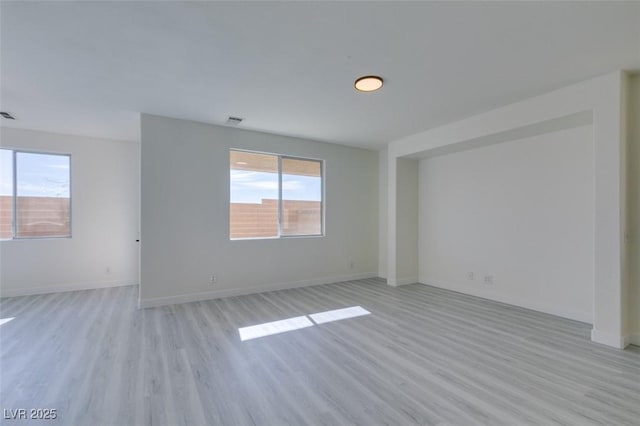 unfurnished room featuring light hardwood / wood-style flooring