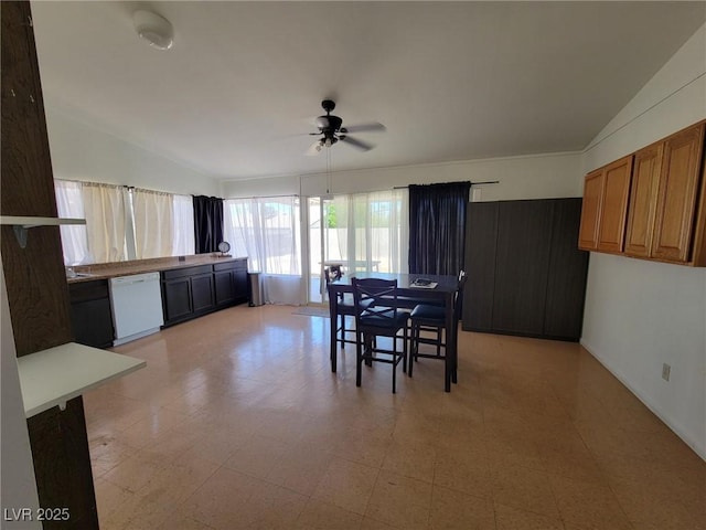 dining area with ceiling fan and vaulted ceiling