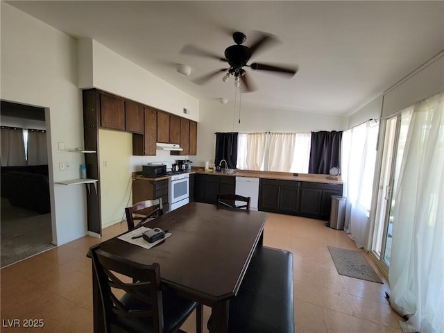 kitchen featuring kitchen peninsula, ceiling fan, white appliances, lofted ceiling, and dark brown cabinetry