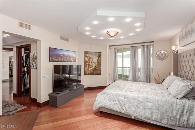 bedroom with hardwood / wood-style flooring