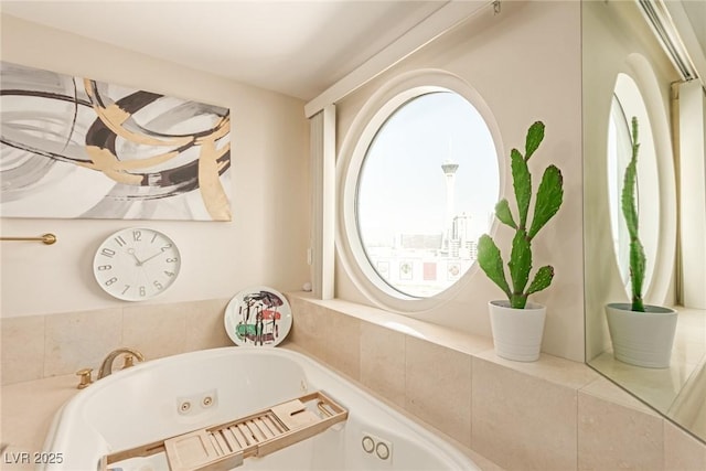 bathroom with tiled bath