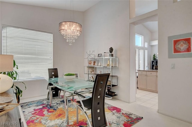 dining area with light carpet, a chandelier, and vaulted ceiling