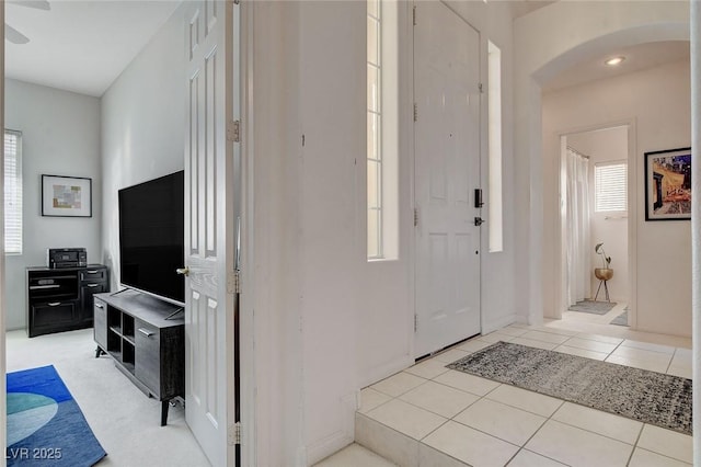 entryway with light tile patterned floors