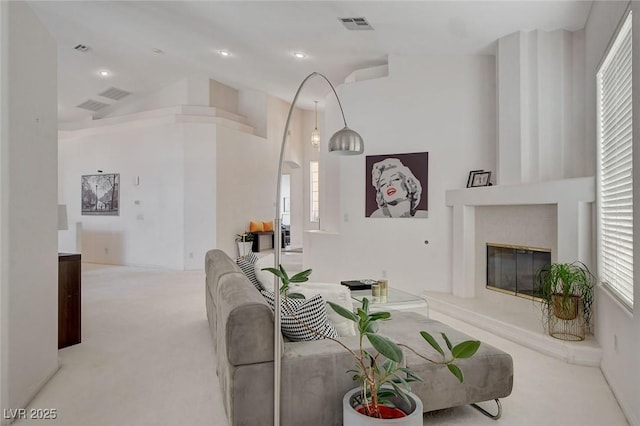 living room with vaulted ceiling and light carpet