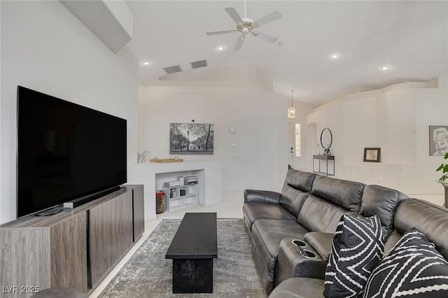 living room with ceiling fan and lofted ceiling