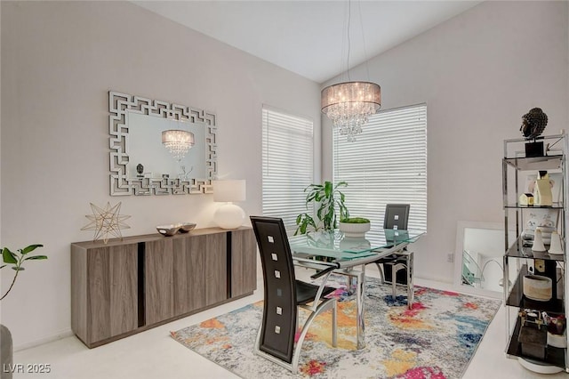 interior space featuring light carpet, a chandelier, and vaulted ceiling