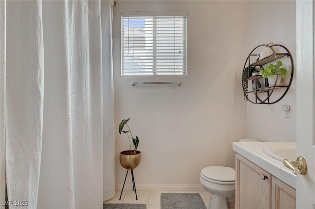 bathroom with toilet, vanity, a shower with curtain, and tile patterned flooring