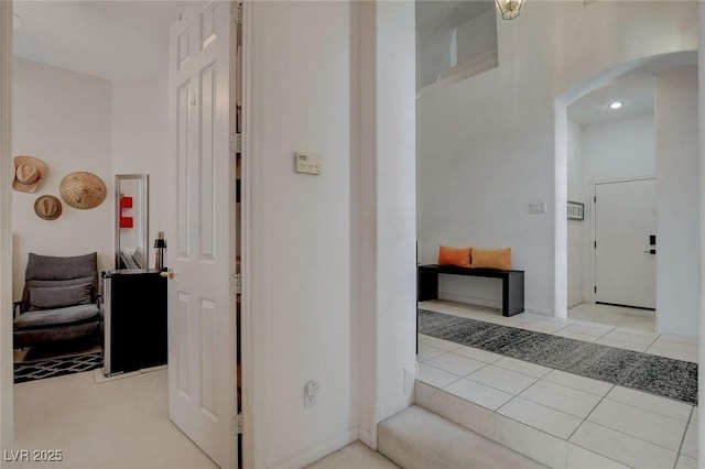 corridor with light tile patterned floors