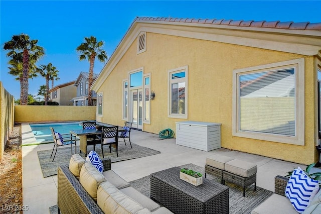 view of patio / terrace featuring an outdoor living space and a fenced in pool