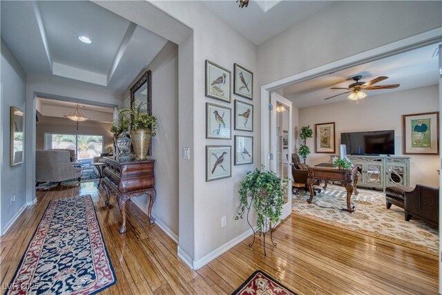 hall with hardwood / wood-style flooring