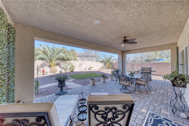 view of patio / terrace featuring a grill and ceiling fan