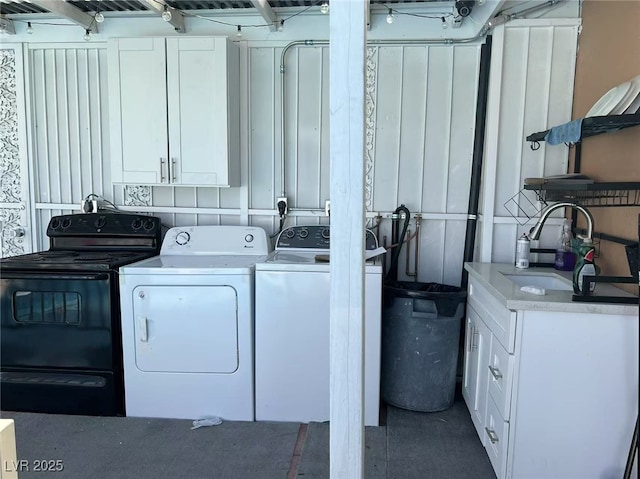 clothes washing area featuring sink and washing machine and clothes dryer