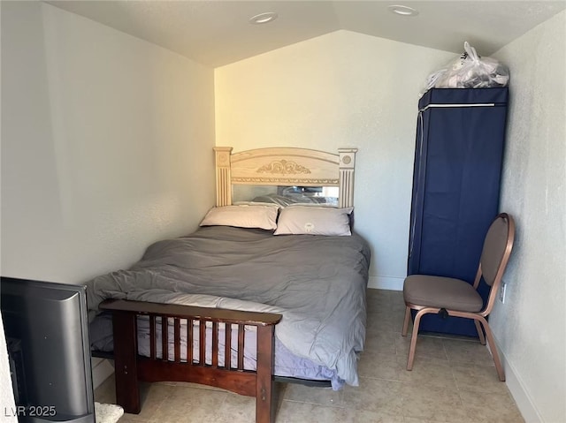 bedroom featuring lofted ceiling