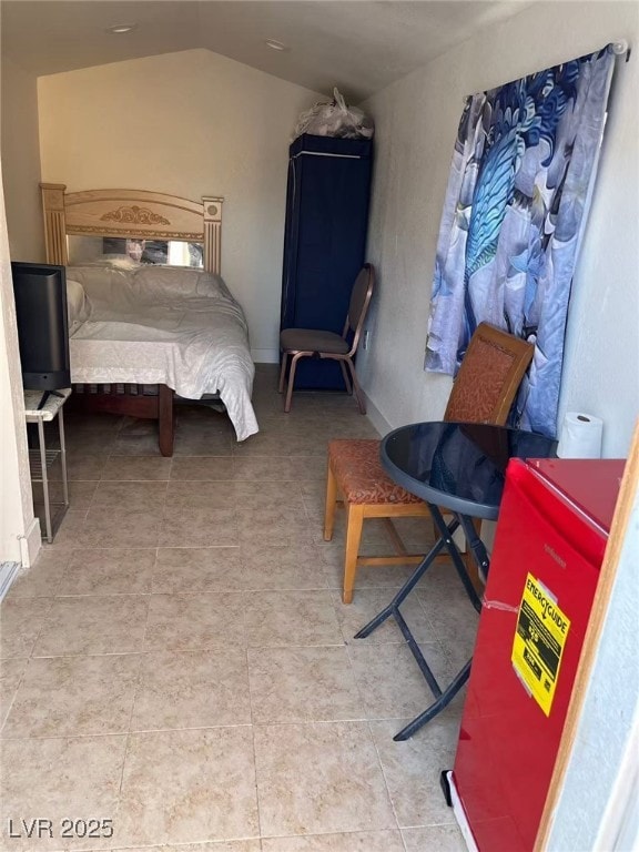 bedroom featuring lofted ceiling