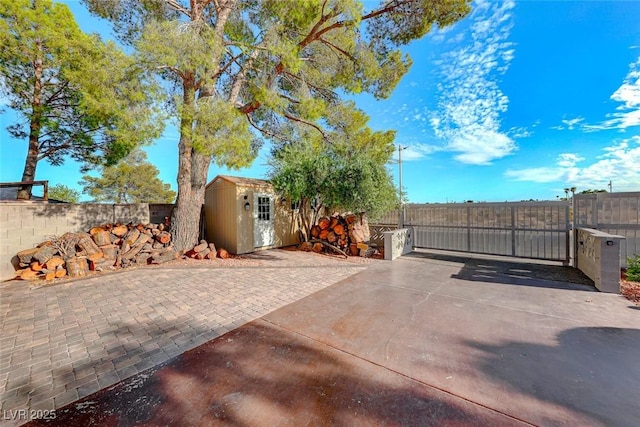 view of patio featuring a storage shed