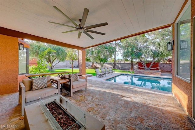 view of pool with ceiling fan and an outdoor living space