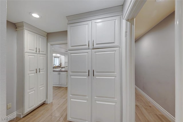 hallway featuring light hardwood / wood-style flooring